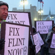 Demonstrators demand action from the Republican presidential candidates about the water crisis in Flint, Mich., outside the historic Fox Theater before the GOP presidential debate March 3, 2016, in Detroit.
Chip Somodevilla/Getty Images